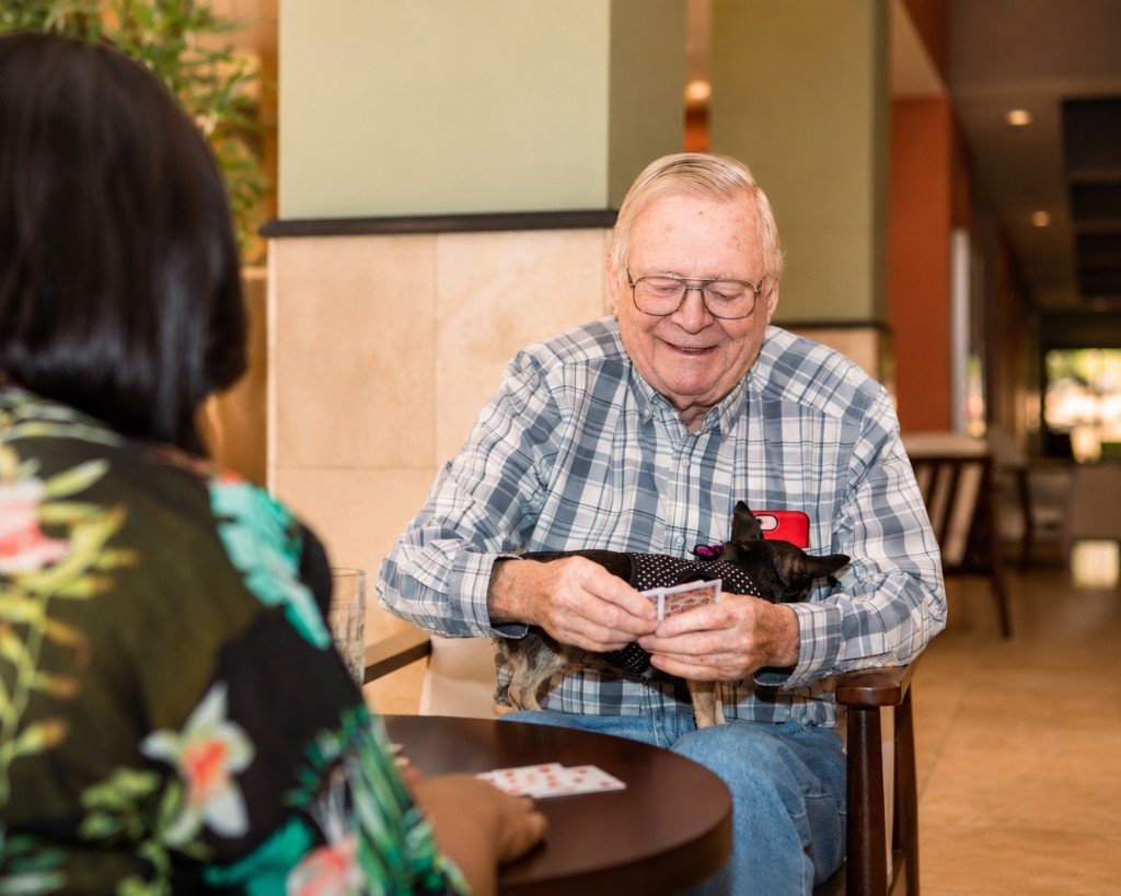 A resident enjoying time with a friend and pet at HSRL