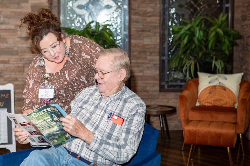 A care team member sharing a quiet, warm moment with a resident